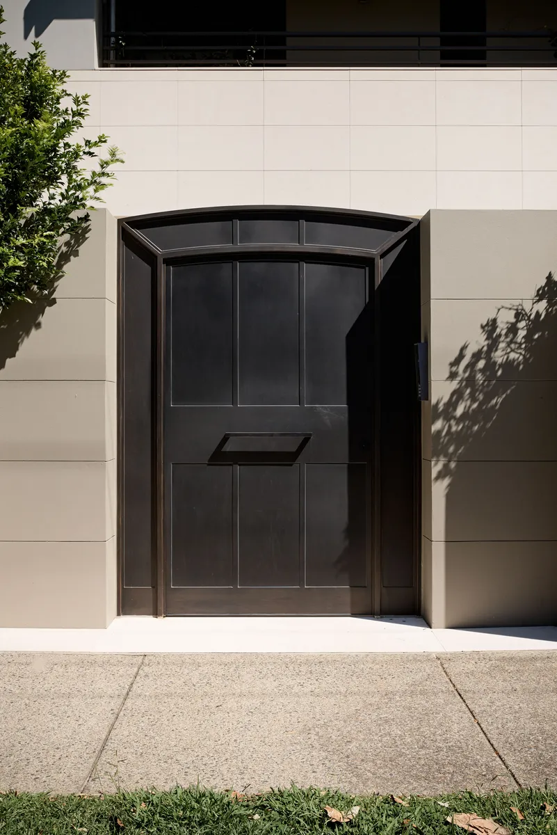 Black steel doors creating indoor outdoor flow in Bellevue Hill home