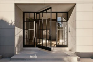 Steela. Bellevue Hill Project - Pivot Door with Fixed Sidelights - Hand-Brushed Bronze Finish - Custom Hardware
